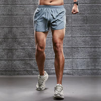 Short running homme gris avec fente