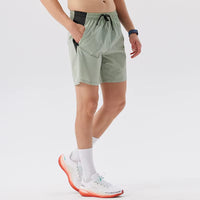 Short running homme vert à séchage rapide